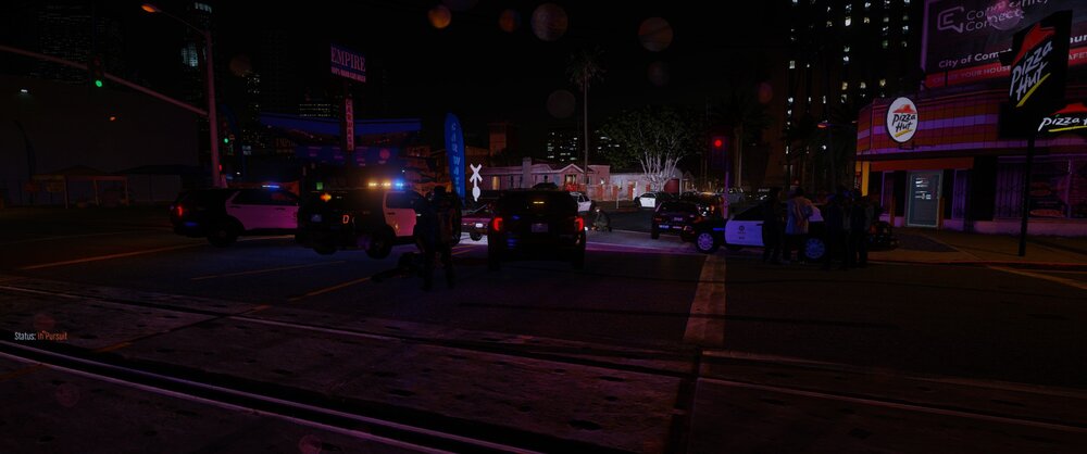 Could contain: outdoor, building, night, electricity, street light, street, darkness, light, road, city