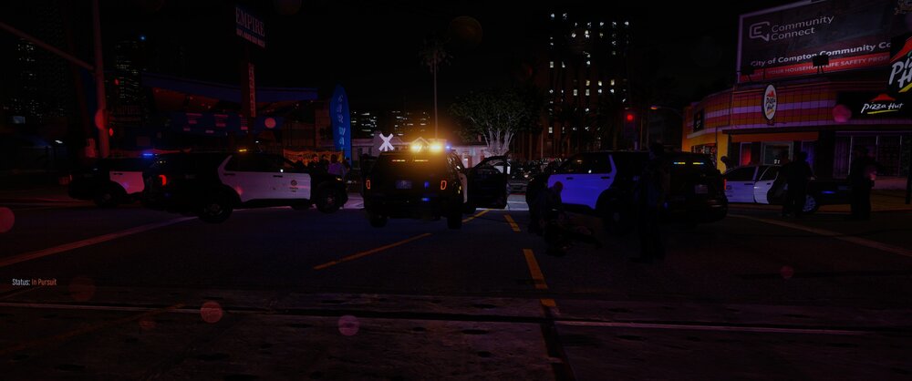 Could contain: outdoor, night, building, street light, electricity, street, road, darkness, sky, light, city, people, sign