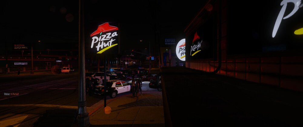 Could contain: outdoor, street light, billboard, night, electronic signage, neon, sky, sign, street, light, city