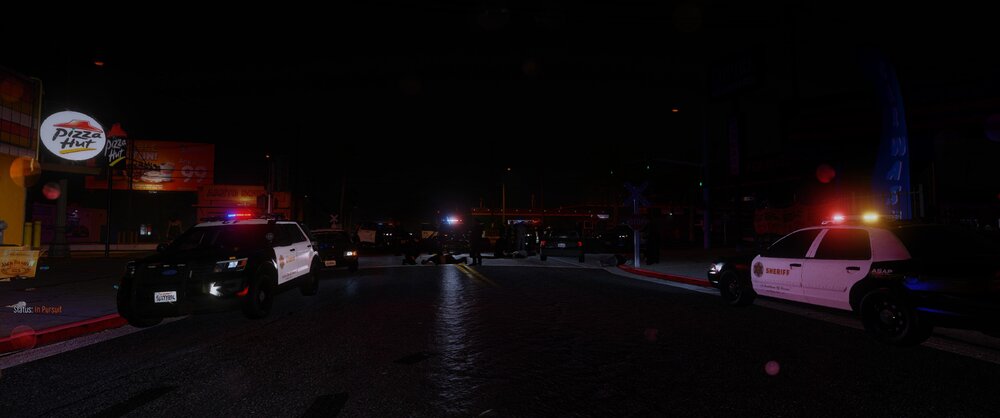 Could contain: outdoor, sky, road, night, vehicle, land vehicle, street light, street, wheel, car, light, sign, dark