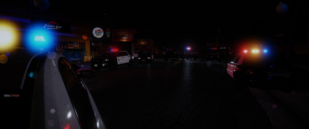 Could contain: outdoor, car, vehicle, night, street, darkness, street light, land vehicle, road, traffic light, dark, city, light