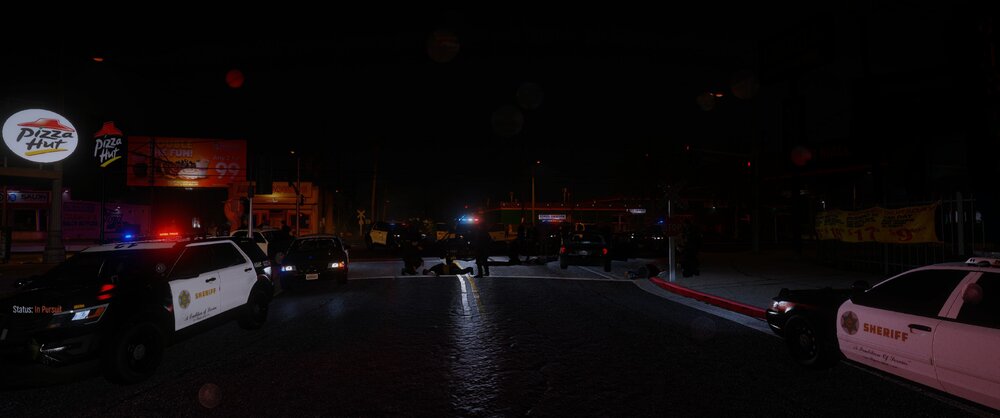 Could contain: vehicle, outdoor, land vehicle, night, text, car, billboard, street, road, light, sign, dark, city