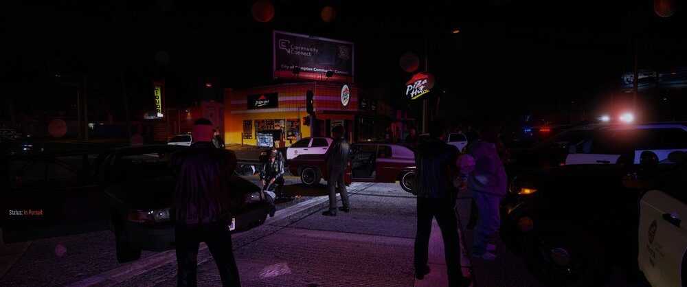 Could contain: outdoor, street, night, vehicle, billboard, land vehicle, person, people, light