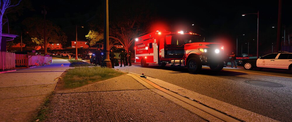 Could contain: outdoor, land vehicle, vehicle, road, street light, electricity, street, night, light, wheel, road surface, ground, city, red, truck