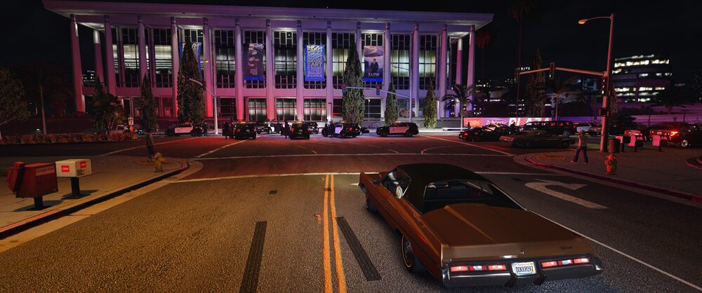 Could contain: outdoor, building, car, road, vehicle, land vehicle, night, street, light, city, ground