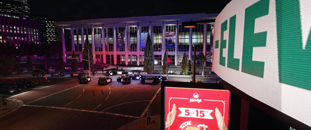 Could contain: building, outdoor, billboard, night, city, sign, street