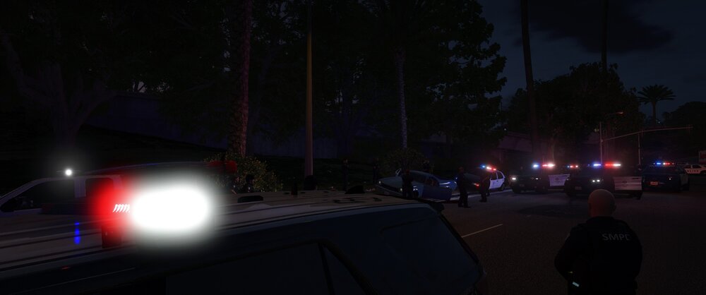 Could contain: outdoor, sky, vehicle, land vehicle, tree, car, darkness, light, road, night, street, dark