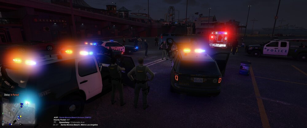 Could contain: vehicle, land vehicle, outdoor, car, road, firefighter, transport, night, light, street, people, police