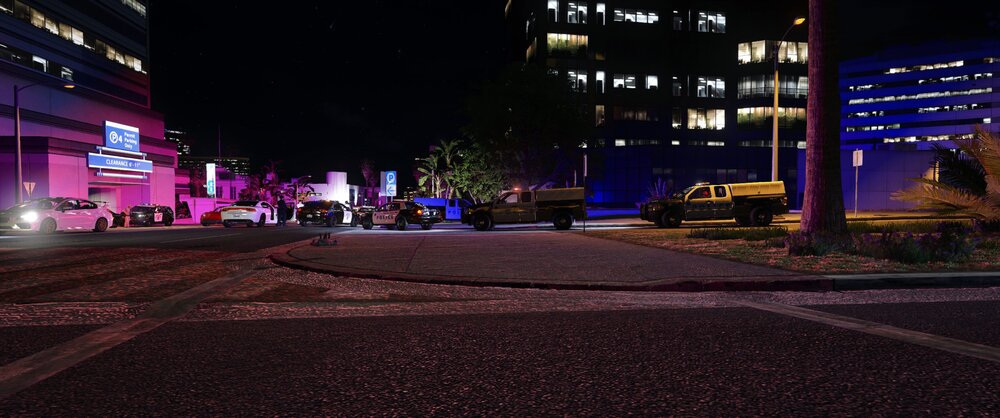 Could contain: outdoor, building, night, street, sky, street light, road, car, electricity, light, tree, city, ground