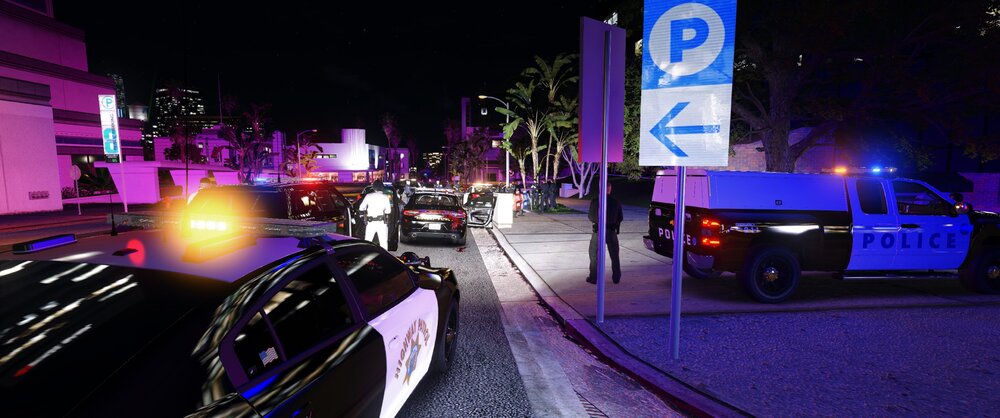 Could contain: outdoor, vehicle, land vehicle, wheel, street, text, road, building, car, light, night, city, sign