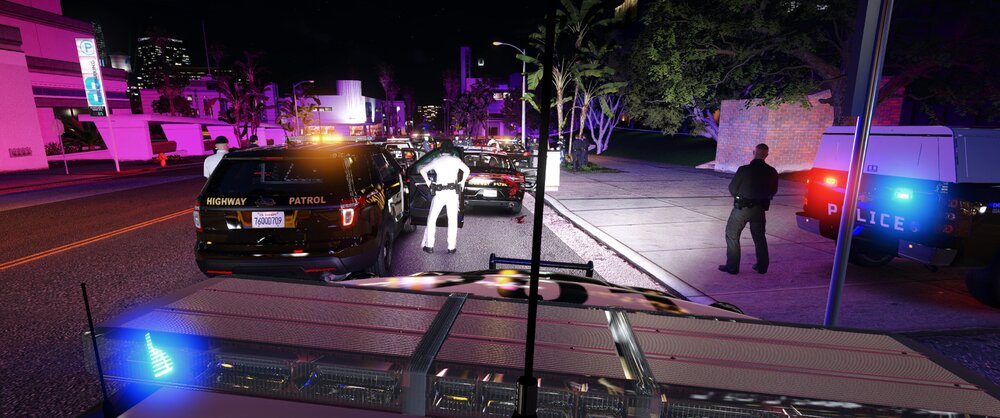 Could contain: outdoor, car, vehicle, land vehicle, electricity, road, tree, street, light, night, ground, city