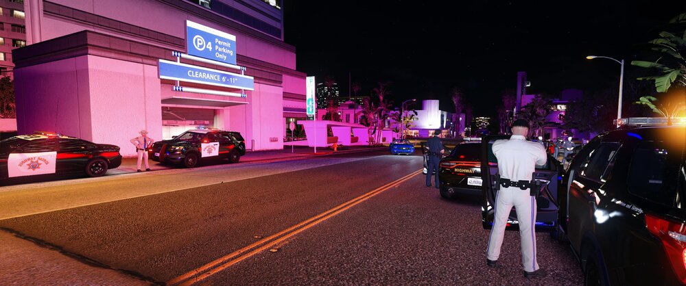 Could contain: car, land vehicle, outdoor, vehicle, road, building, clothing, wheel, text, street, person, night, light, city, ground