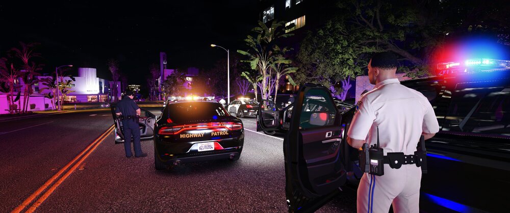 Could contain: clothing, outdoor, vehicle, car, land vehicle, person, man, road, street, wheel, vehicle registration plate, light, night, city, ground