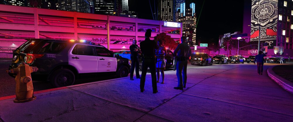 Could contain: land vehicle, vehicle, building, outdoor, wheel, skyscraper, night, car, city, street, person, ground, people, light