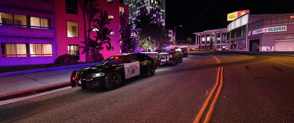 Could contain: vehicle, land vehicle, outdoor, building, road, wheel, street, city, car, purple, light, night