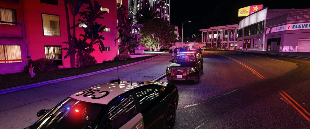 Could contain: vehicle, building, car, land vehicle, outdoor, night, road, street, wheel, city, light, purple