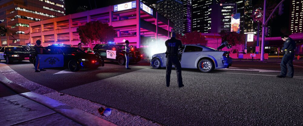 Could contain: outdoor, building, vehicle, land vehicle, car, wheel, ground, tire, street, night, road, city, light, parked