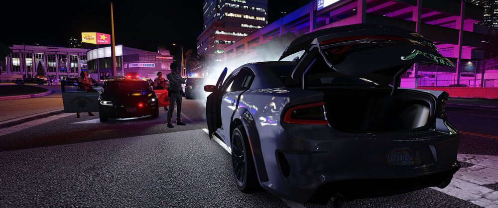 Could contain: vehicle, land vehicle, wheel, tire, outdoor, automotive design, automotive lighting, auto part, text, building, automotive tail & brake light, mid-size car, ground, night, street, parked, light, car