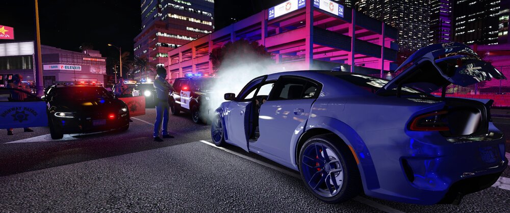 Could contain: vehicle, land vehicle, wheel, tire, building, automotive design, mid-size car, automotive lighting, auto part, outdoor, alloy wheel, sports sedan, road, transport, purple, ground, parked, street, city, car, night