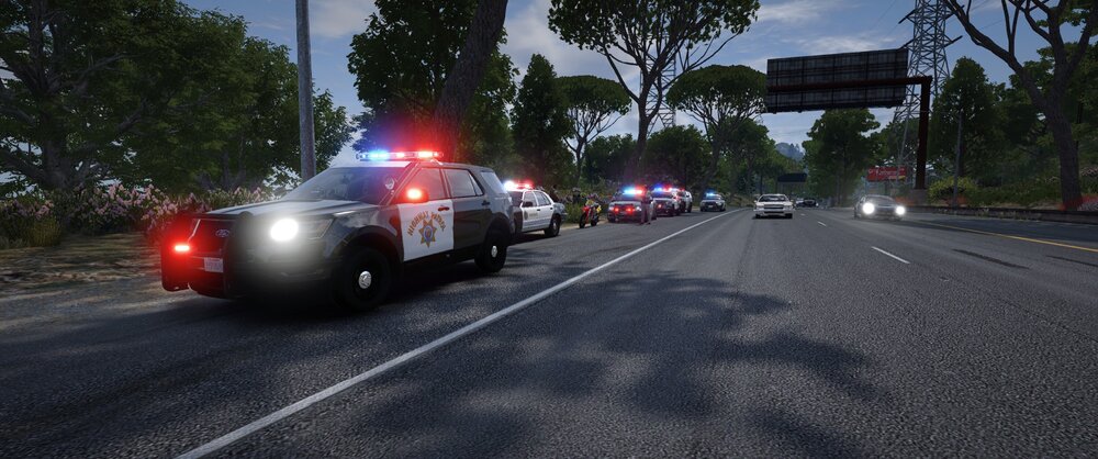 Could contain: outdoor, land vehicle, vehicle, road, sky, wheel, tree, car, street, road surface, asphalt, text, thoroughfare, lane, tarmac, vehicle registration plate, auto part, motor vehicle, traffic, automotive exterior, highway, tar, automotive tail & brake light, light, driving, way