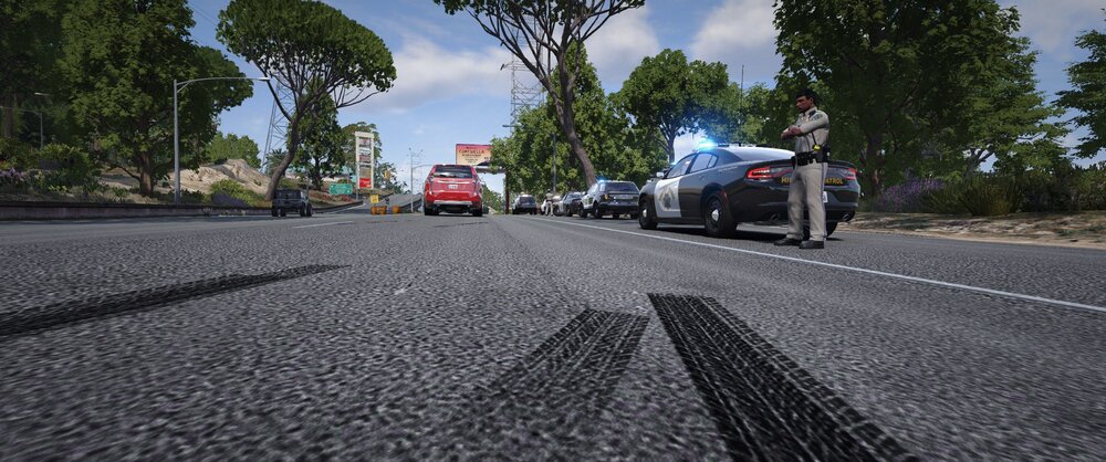 Could contain: outdoor, sky, road, vehicle, land vehicle, tree, wheel, road surface, asphalt, tarmac, car, cloud, tar, thoroughfare, lane, way, tire, street, ground