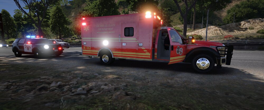 Could contain: vehicle, outdoor, land vehicle, wheel, transport, tree, emergency service, fire, firefighter, emergency vehicle, tire, auto part, emergency, road, truck, ground, fire department, fire apparatus, motor vehicle, parked, ambulance, light, red