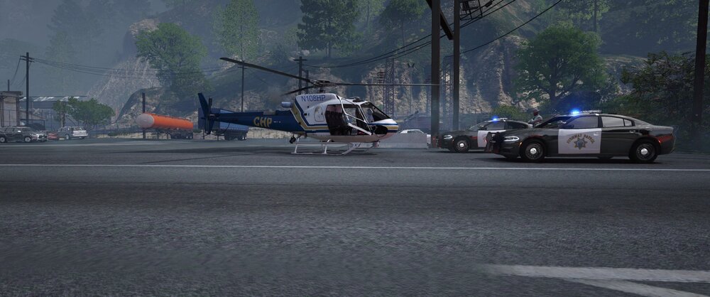 Could contain: outdoor, vehicle, road, transport, tree, wheel, car, land vehicle, asphalt, tire, street, helicopter