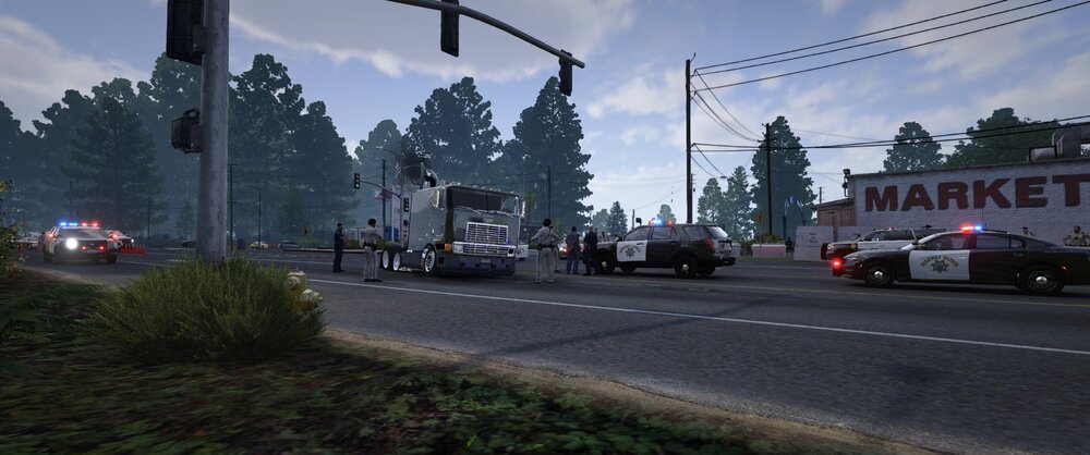 Could contain: outdoor, sky, road, vehicle, land vehicle, cloud, street, tree, wheel, way, road surface, asphalt, lane, traffic light, street light, thoroughfare, public utility, electricity, light, signaling device, car, truck, intersection