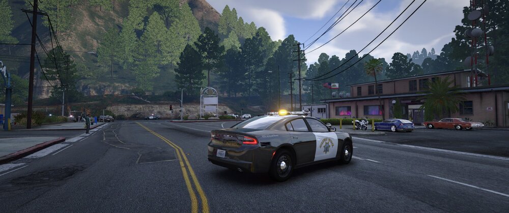 Could contain: outdoor, vehicle, land vehicle, road, wheel, sky, tree, street, transport, car, lane, tire, driving, light, military vehicle