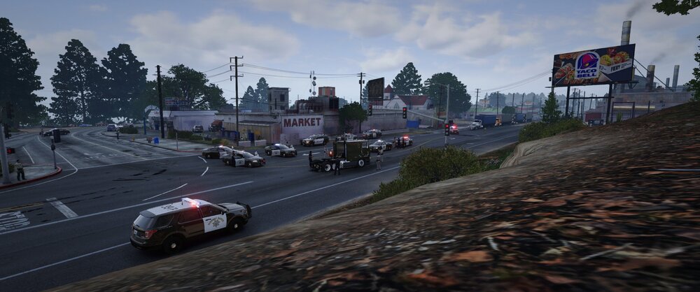 Could contain: outdoor, vehicle, land vehicle, road, wheel, sky, cloud, street, motorsport, motorcycle, tree, way, ground, car