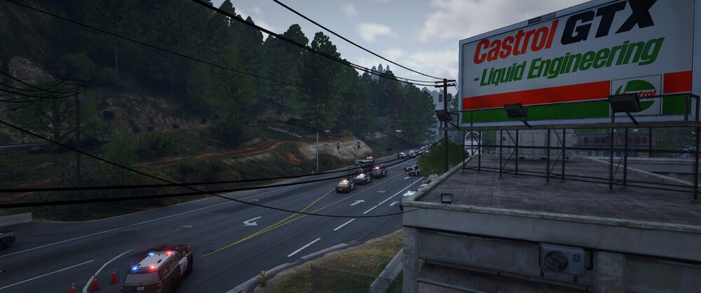 Could contain: outdoor, road, text, cloud, sky, lane, tree, thoroughfare, way, street, asphalt, infrastructure, road surface, freeway, vehicle, billboard, sign, highway, roadway, travel