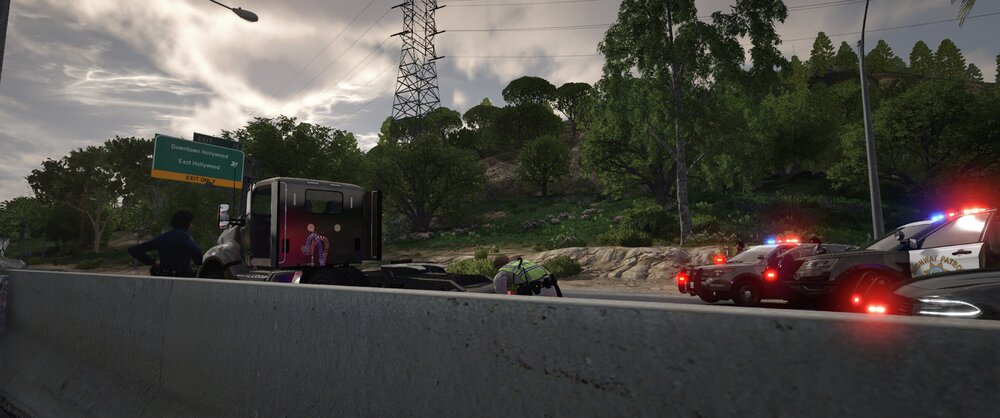 Could contain: outdoor, sky, road, cloud, land vehicle, tree, vehicle, road surface, asphalt, street, street light, wheel, light