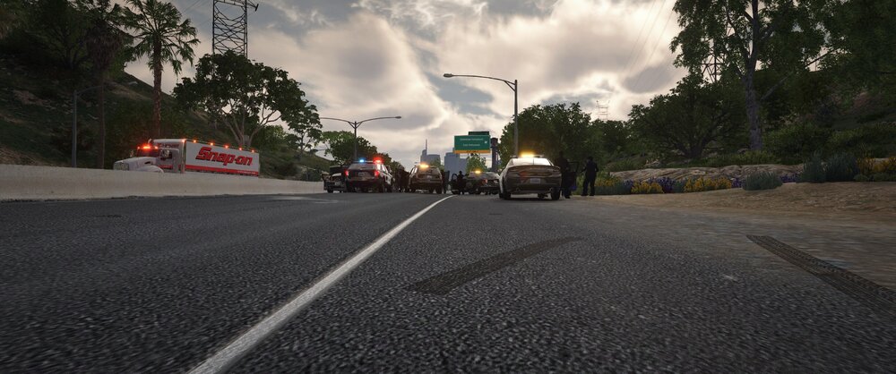 Could contain: outdoor, cloud, road, sky, asphalt, road surface, land vehicle, way, vehicle, thoroughfare, tarmac, tree, tar, wheel, lane, street, highway, infrastructure, mode of transport, ground, driving