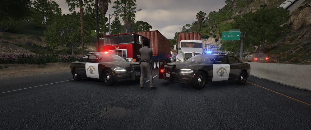 Could contain: outdoor, vehicle, road, wheel, land vehicle, tire, sky, auto part, transport, motor vehicle, asphalt, tarmac, road surface, tree, mode of transport, car, truck, police, street