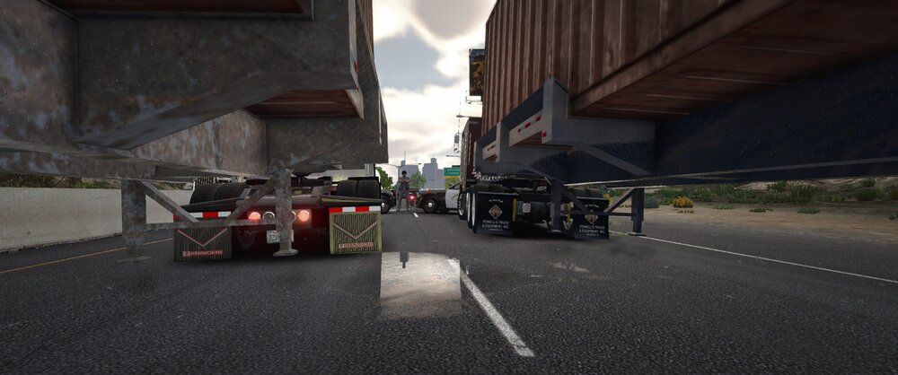 Could contain: outdoor, road, wheel, sky, vehicle, land vehicle, tire, road surface, asphalt, auto part, building, tarmac, tar, infrastructure, street, ground, truck