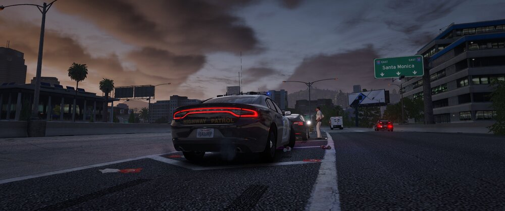 Could contain: cloud, sky, outdoor, vehicle, land vehicle, road, wheel, street, automotive design, car, text, auto part, city, way, ground, dark