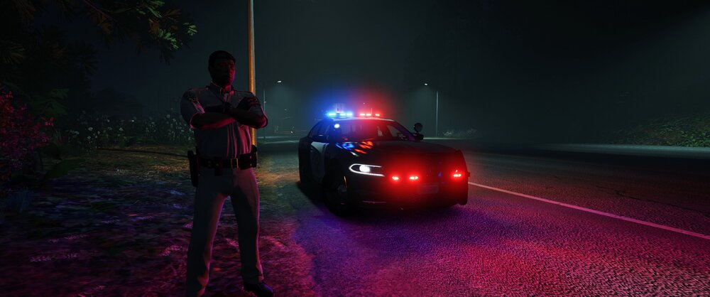 Could contain: vehicle, land vehicle, outdoor, car, tire, road, wheel, ground, light, person, night, red, street