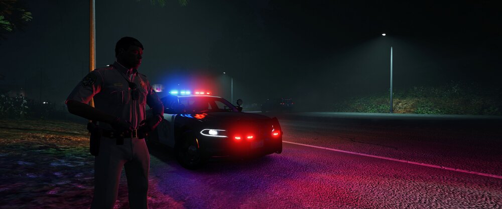 Could contain: outdoor, car, vehicle, land vehicle, person, light, clothing, road, automotive lighting, tire, automotive tail & brake light, wheel, night, ground, woman, lamp, street