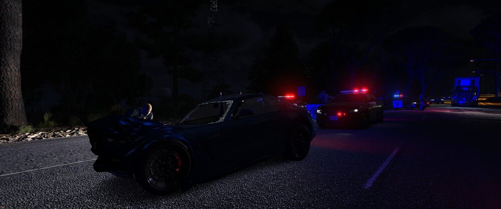 Could contain: vehicle, land vehicle, wheel, outdoor, tire, road, auto part, automotive design, automotive lighting, street, night, dark, transport, light, ground, car, parked