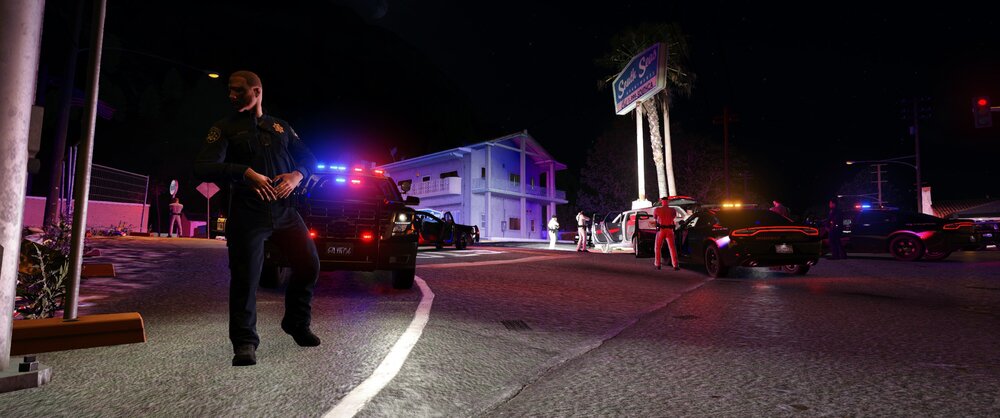 Could contain: outdoor, sky, road, car, vehicle, building, street, street light, land vehicle, footwear, person, light, night, people, standing, city