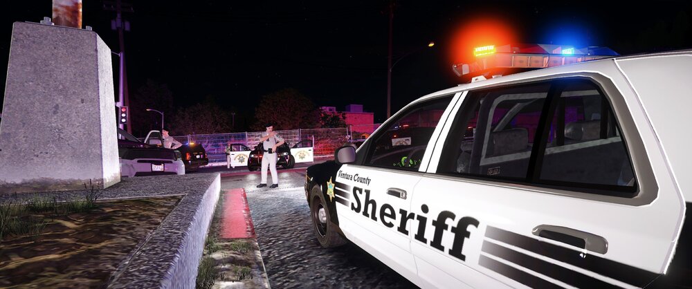 Could contain: vehicle, outdoor, land vehicle, transport, text, street, light, car, police, ground