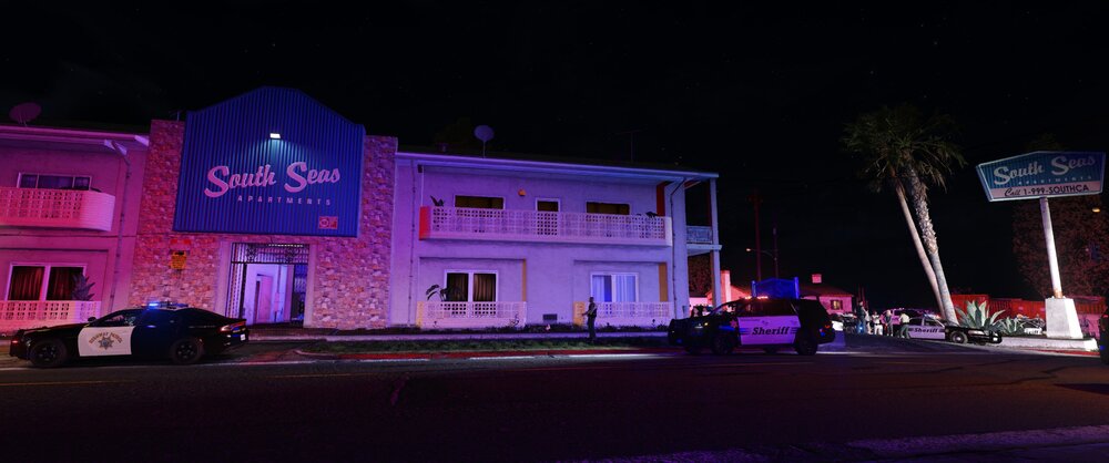 Could contain: building, outdoor, sky, night, road, house, street, light, purple
