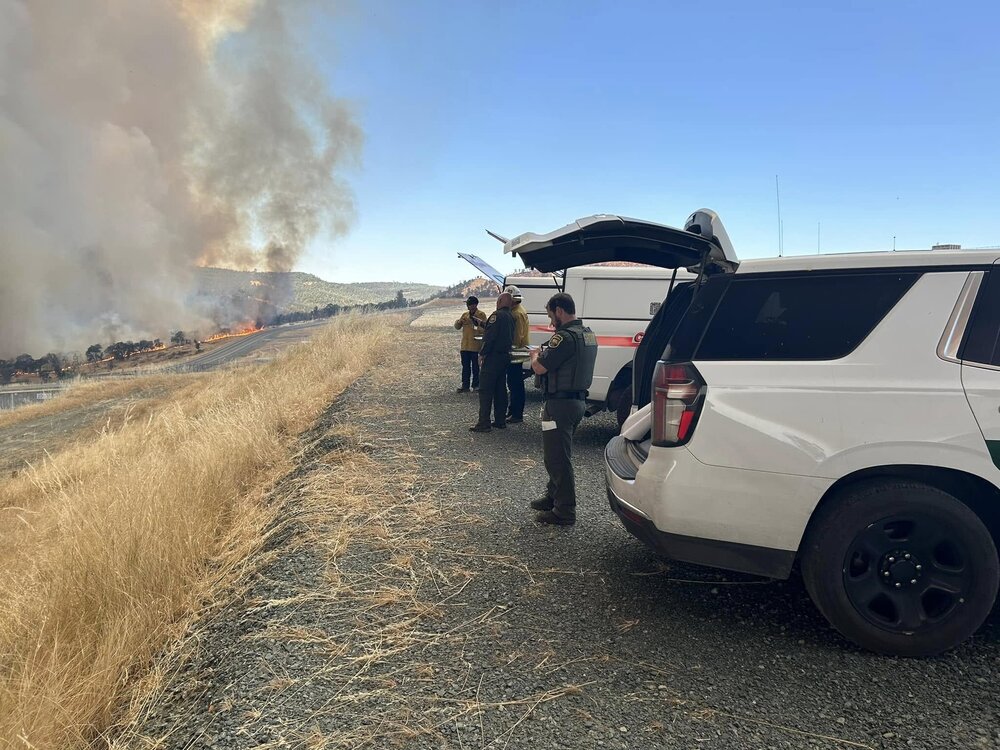 Could contain: outdoor, land vehicle, wheel, sky, tire, transport, ground, auto part, automotive tire, person, parked, people, car, vehicle