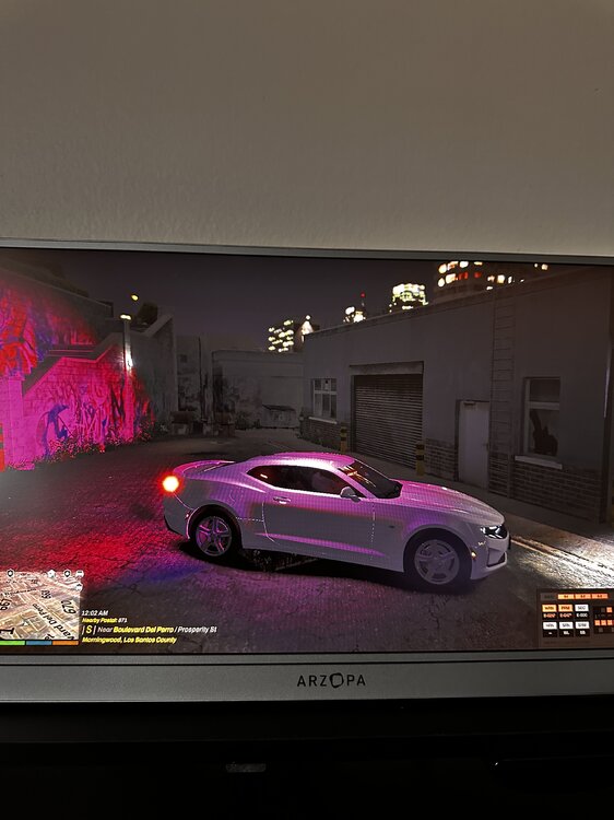 Could contain: vehicle, land vehicle, wheel, text, automotive design, car, tire, auto part, automotive lighting, transport, purple, wall, outdoor