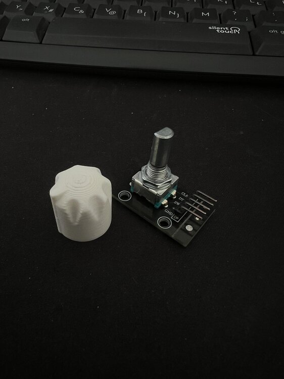 Could contain: computer keyboard, input device, laptop, indoor, computer, computer component, peripheral, keyboard