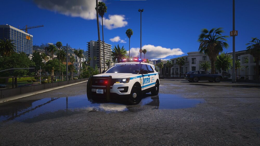 Could contain: sky, outdoor, vehicle, land vehicle, wheel, cloud, vehicle registration plate, mid-size car, road, text, full-size car, police car, ford, street, automotive exterior, transport, car, police, blue, ground