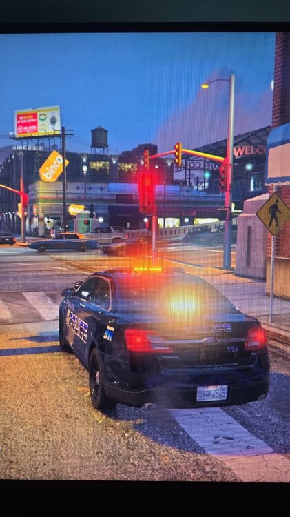 Could contain: vehicle, land vehicle, text, outdoor, sky, building, wheel, car, road, billboard, street, automotive tail & brake light, automotive lighting, light, night, ground, city