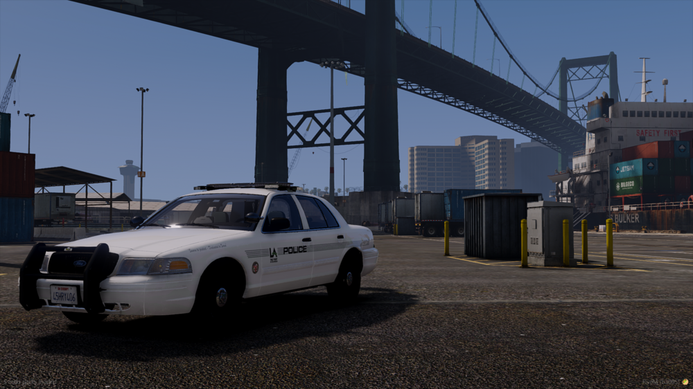 Could contain: vehicle, land vehicle, outdoor, wheel, sky, tire, car, building, ford crown victoria police interceptor, sedan, transport, ground, road, parked, police