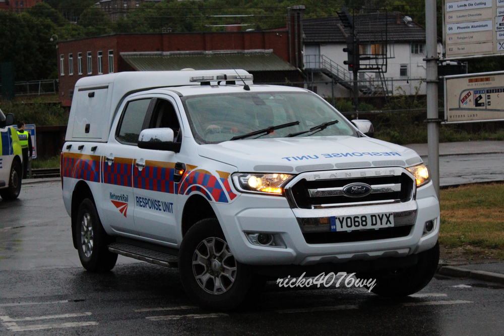 Could contain: vehicle, land vehicle, text, wheel, transport, outdoor, tire, ford, bumper, emergency vehicle, emergency service, vehicle registration plate, sport utility vehicle, grille, motor vehicle, car, ford motor company, auto part, chevrolet, police, emergency, general motors, mitsubishi, compact sport utility vehicle, road, parked, truck