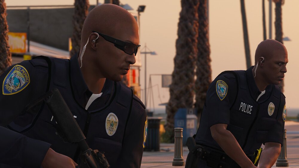 Could contain: clothing, person, outdoor, man, law enforcement, human face, police officer, security, official, officer, sunglasses, government agency, uniform, police